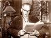 Einar Beer in the livingroom of Shantibu, reading a book by Sri Ananda, 1972.